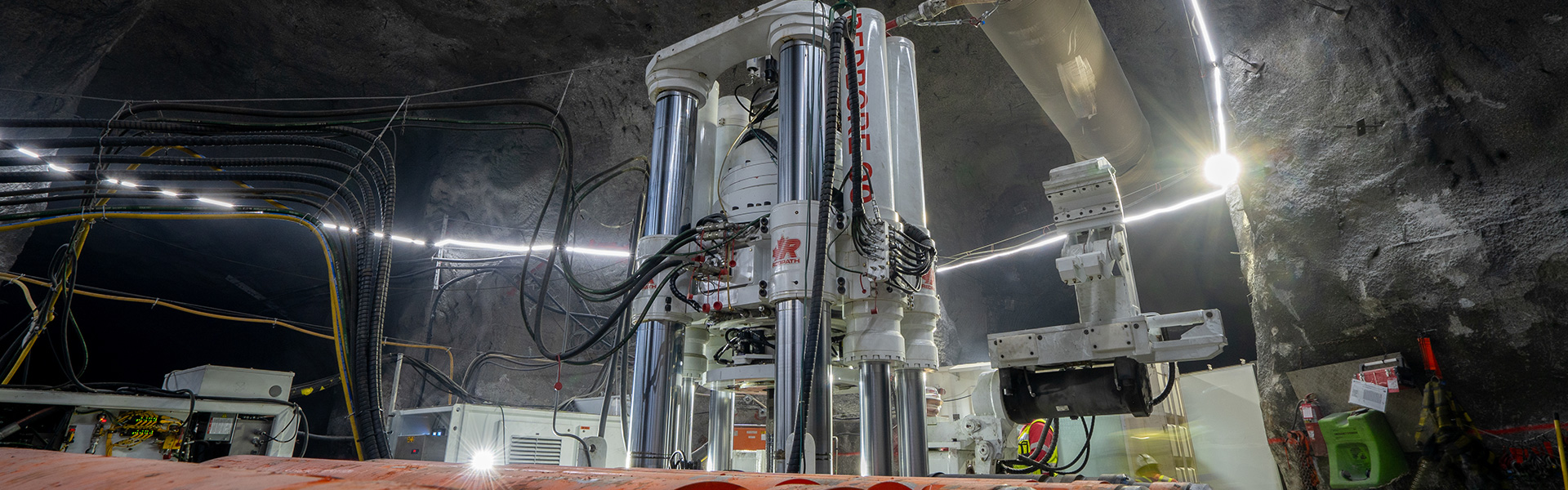 The website banner for the Granny Smith project page shows a Redbore 90 raisebore drill operating in an underground mine.